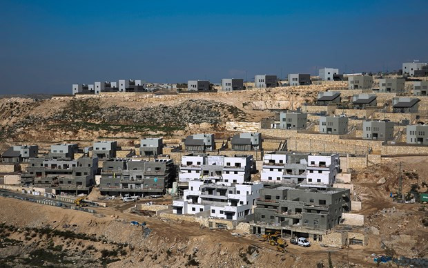 Israel tạm dừng tuyên bố chủ quyền ở các khu định cư Bờ Tây. (Ảnh: AP).