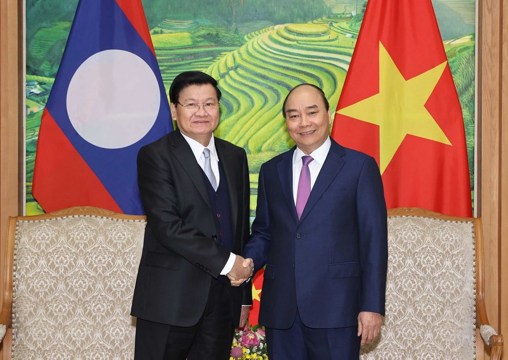 Thủ tướng Nguyễn Xuân Phúc và Thủ tướng Lào Thongloun Sisoulith. (Ảnh: Thống Nhất/TTXVN).