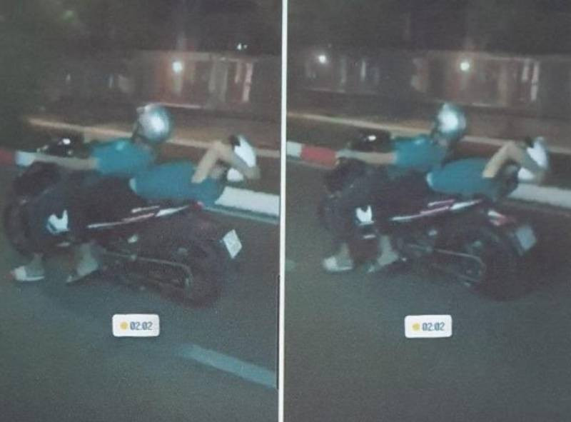 Hai thiếu niên nằm điều khiển xe trong clip là NHP (gần 16 tuổi, con trai bà NTHT) và người ngồi sau xe là PMK (15 tuổi). Hình ảnh vi phạm cắt từ clip.