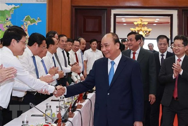 Chủ tịch nước Nguyễn Xuân Phúc với các đại biểu. (Ảnh: Thống Nhất/TTXVN).
