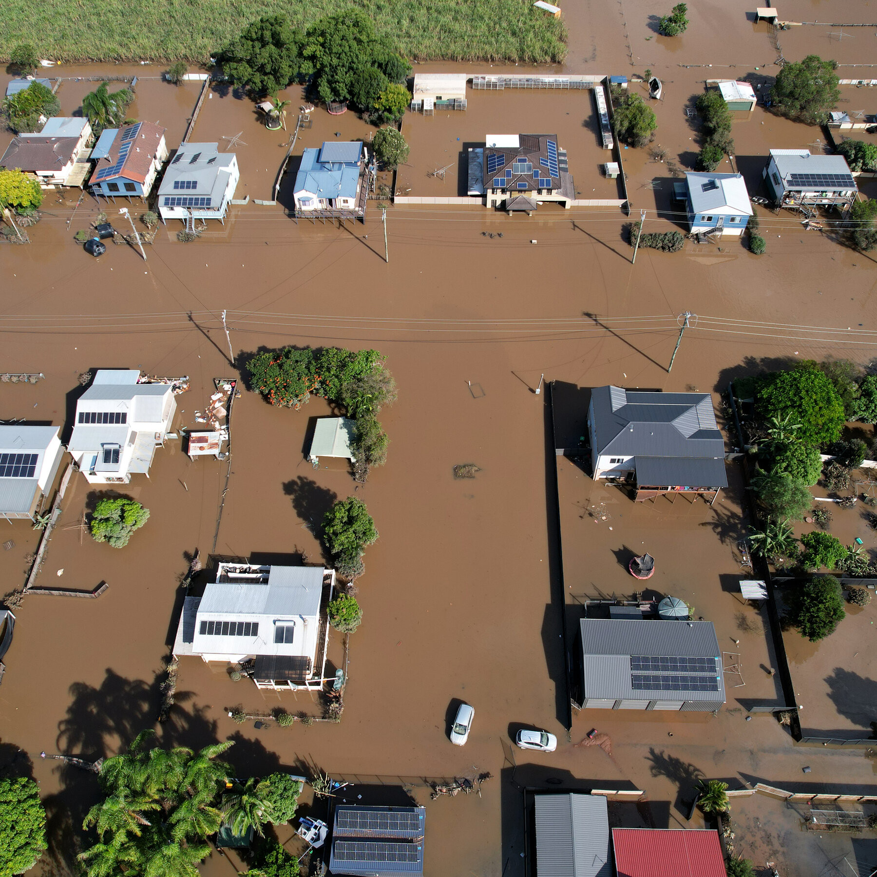 Quang cảnh những ngôi nhà bị ngập trong nước lũ ở Woodburn, New South Wales, Australia. Ảnh: NY Times.
