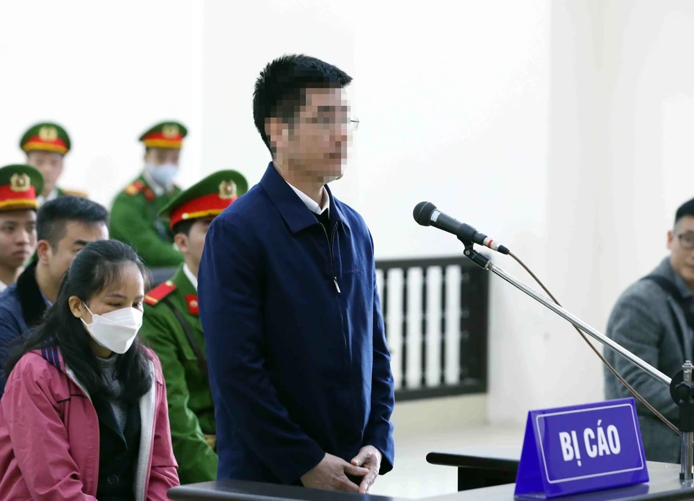 Bị cáo Hoàng Văn Hưng, cựu cán bộ công an khai báo trước tòa. (Ảnh: Phạm Kiên/TTXVN)