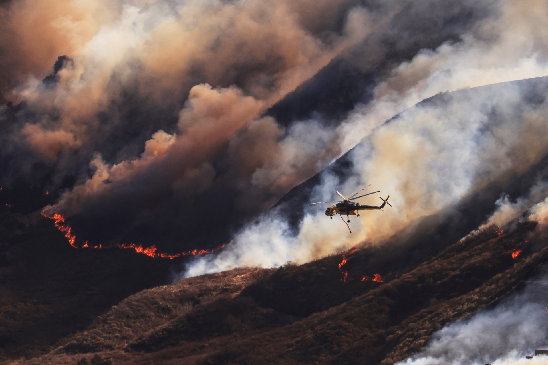 Smoke billows from the Mountain Fire, in California